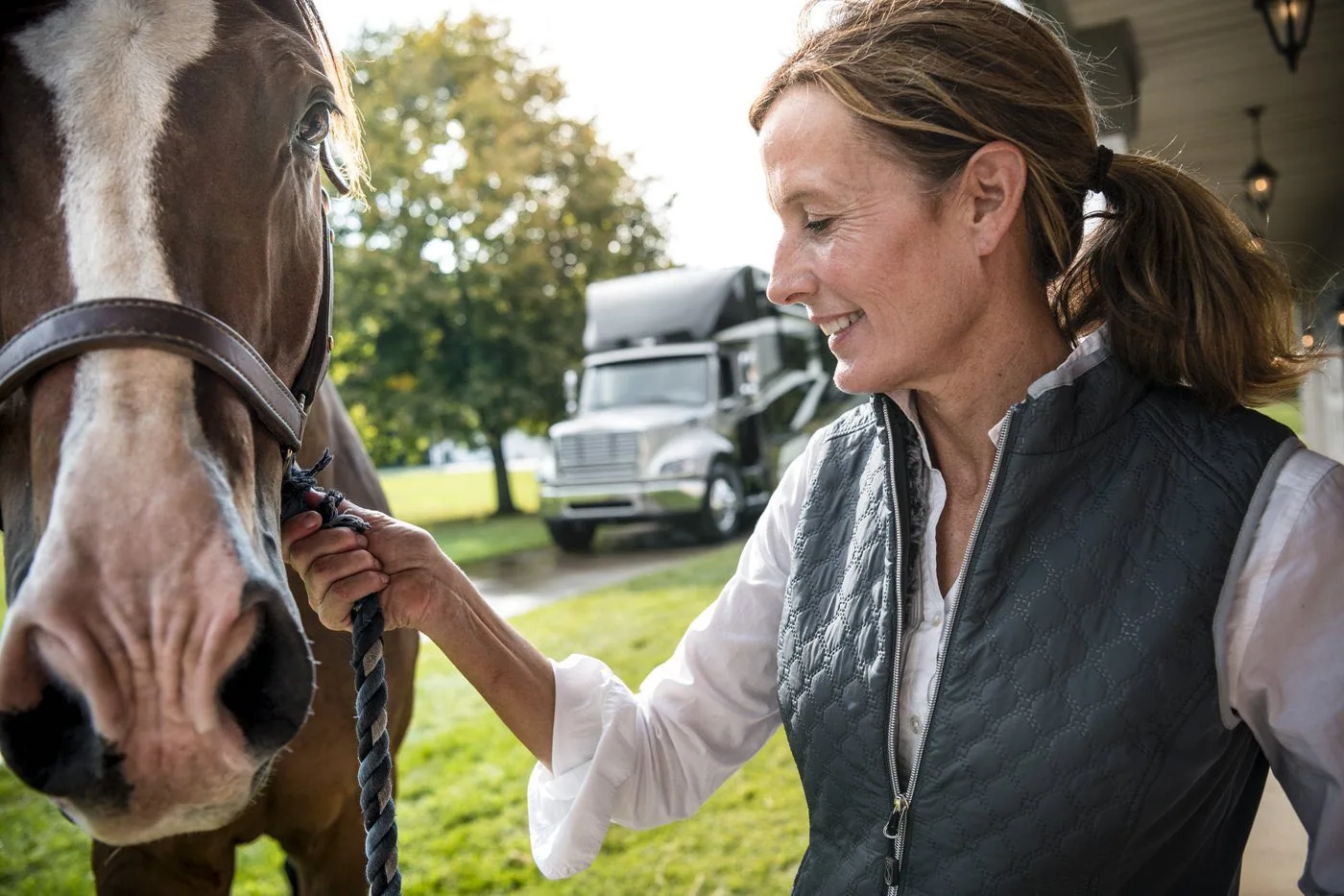 Newmar coach owner with horse at farm property